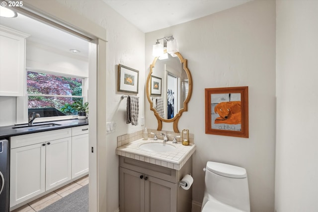 2550 Dellwood Dr, Lake Oswego, OR 97034 - half bath with vanity, toilet, tile patterned floors, and washer / clothes dryer