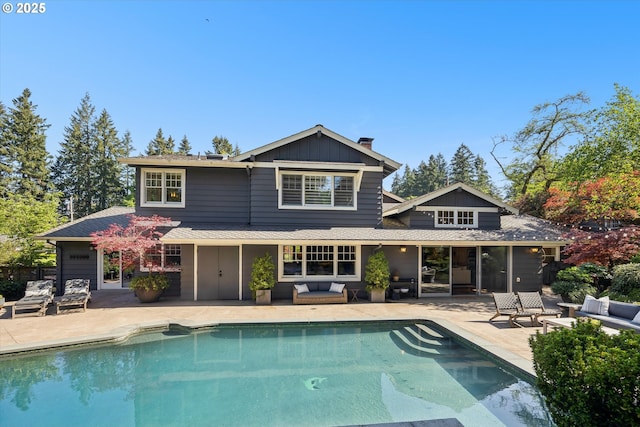 2550 Dellwood Dr, Lake Oswego, OR 97034 - back of house featuring a patio area, an outdoor pool, and a chimney
