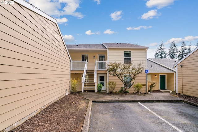 13216 NE Salmon Creek Ave Unit E8, Vancouver, WA 98686 - view of building exterior with stairs and uncovered parking