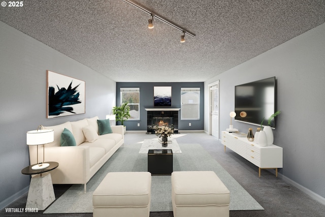 13216 NE Salmon Creek Ave Unit E8, Vancouver, WA 98686 - carpeted living room featuring rail lighting, a tile fireplace, a textured ceiling, and baseboards