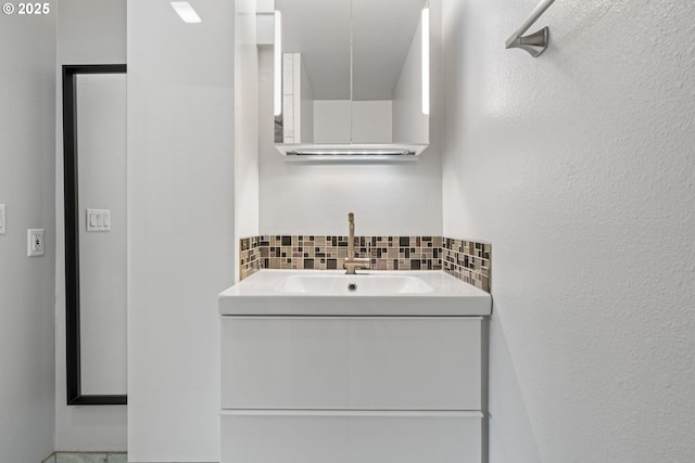13216 NE Salmon Creek Ave Unit E8, Vancouver, WA 98686 - bathroom with vanity and tasteful backsplash
