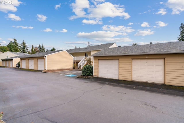 13216 NE Salmon Creek Ave Unit E8, Vancouver, WA 98686 - view of front of home featuring community garages and an outbuilding