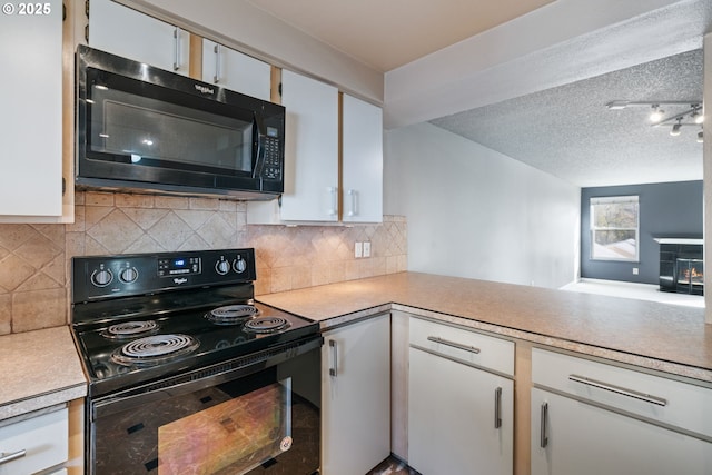 13216 NE Salmon Creek Ave Unit E8, Vancouver, WA 98686 - kitchen featuring black appliances, light countertops, white cabinetry, tasteful backsplash, and a textured ceiling