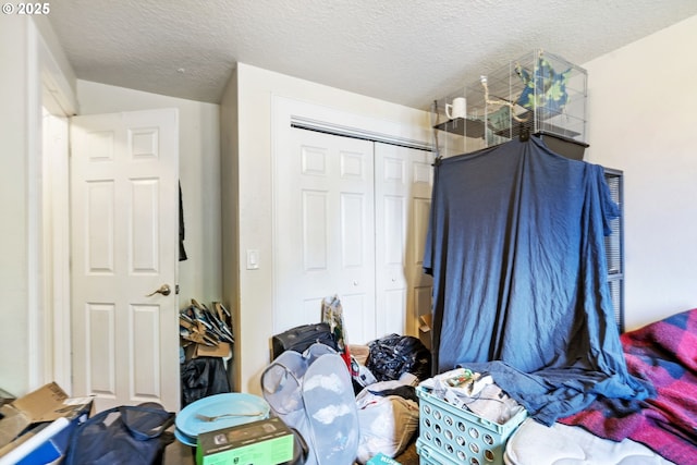 bedroom with a closet and a textured ceiling