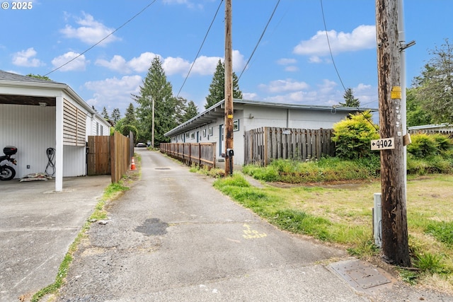 view of property exterior featuring fence