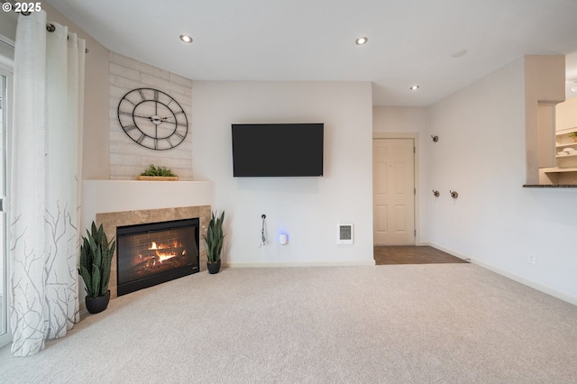 10664 NE Holly St # 206, Hillsboro, OR 97006 - unfurnished living room featuring carpet, a tiled fireplace, and recessed lighting