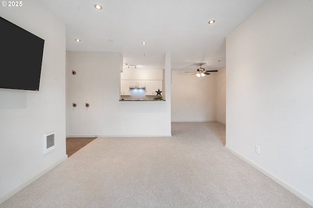 10664 NE Holly St # 206, Hillsboro, OR 97006 - unfurnished living room with light colored carpet, ceiling fan, and recessed lighting