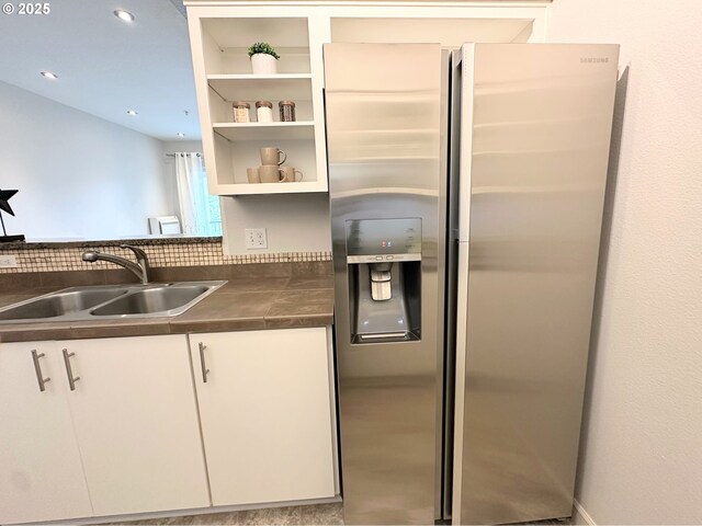 10664 NE Holly St # 206, Hillsboro, OR 97006 - kitchen featuring stainless steel fridge with ice dispenser, white cabinets, dark countertops, recessed lighting, and open shelves