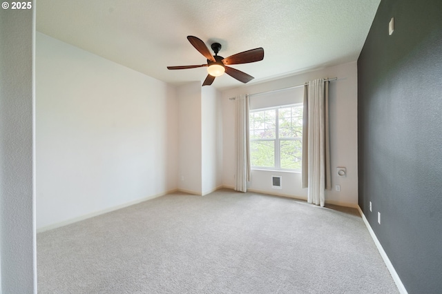 10664 NE Holly St # 206, Hillsboro, OR 97006 - spare room featuring ceiling fan and light colored carpet