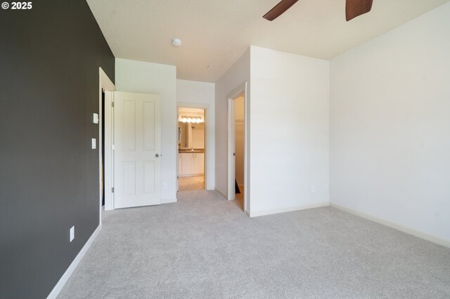 10664 NE Holly St # 206, Hillsboro, OR 97006 - unfurnished bedroom featuring carpet floors, ensuite bathroom, and ceiling fan