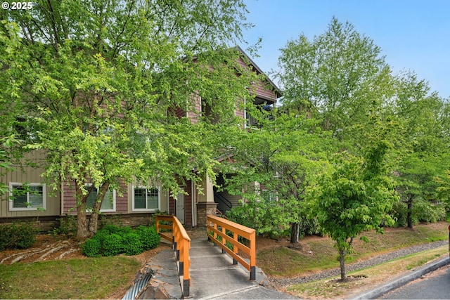 10664 NE Holly St # 206, Hillsboro, OR 97006 - view of property hidden behind natural elements featuring stone siding