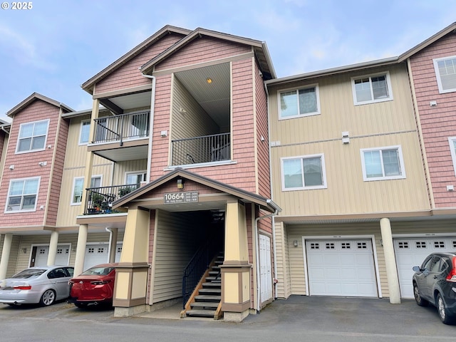 10664 NE Holly St # 206, Hillsboro, OR 97006 - view of building exterior with a garage and driveway