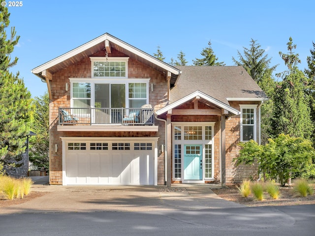 10305 Pine Ridge Dr, Manzanita, OR 97130 - view of front facade featuring concrete driveway, a balcony, an attached garage, and a shingled roof