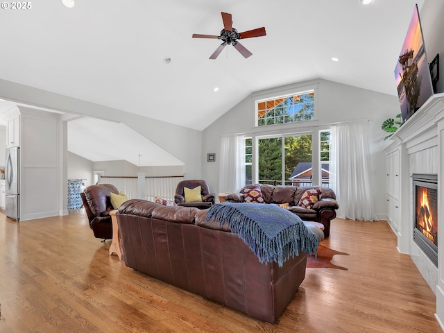 10305 Pine Ridge Dr, Manzanita, OR 97130 - living area featuring a ceiling fan, a tile fireplace, light wood-style floors, recessed lighting, and high vaulted ceiling