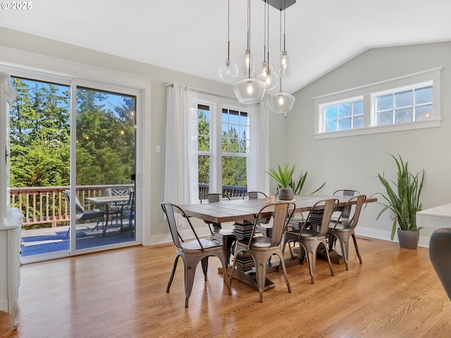 10305 Pine Ridge Dr, Manzanita, OR 97130 - dining area with vaulted ceiling and light wood-style floors