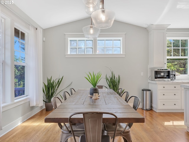 10305 Pine Ridge Dr, Manzanita, OR 97130 - dining room featuring light wood-style flooring and lofted ceiling