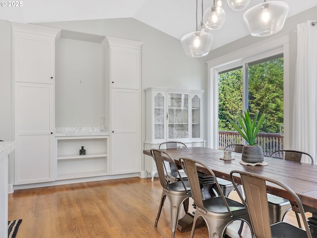 10305 Pine Ridge Dr, Manzanita, OR 97130 - dining area featuring lofted ceiling and light wood-style flooring