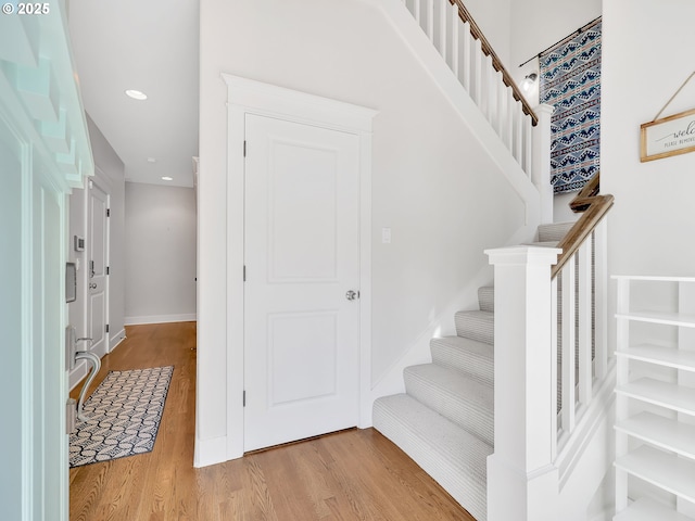 10305 Pine Ridge Dr, Manzanita, OR 97130 - foyer featuring wood finished floors, stairs, and recessed lighting