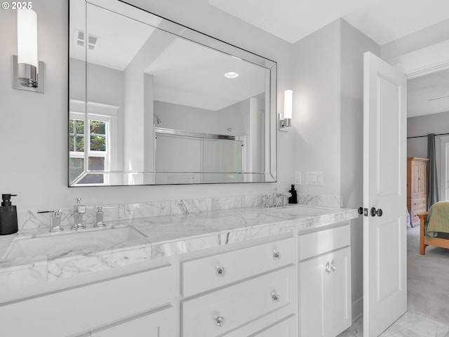10305 Pine Ridge Dr, Manzanita, OR 97130 - ensuite bathroom featuring double vanity, marble look tile flooring, and a shower with shower door