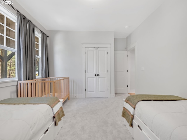 10305 Pine Ridge Dr, Manzanita, OR 97130 - bedroom featuring light colored carpet and a closet