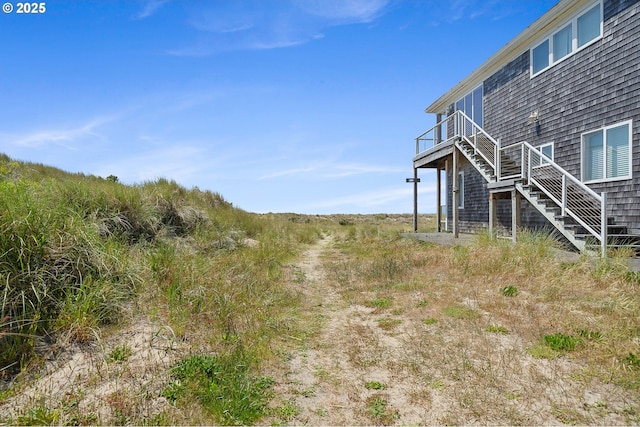 8890 Ocean Crest Ln, Manzanita, OR 97130 - view of yard featuring stairway and a deck