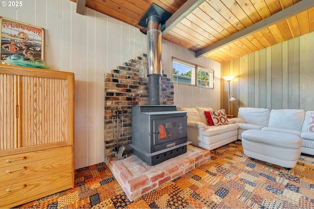 8890 Ocean Crest Ln, Manzanita, OR 97130 - living area with a wood stove, wood walls, and wood ceiling with exposed beams