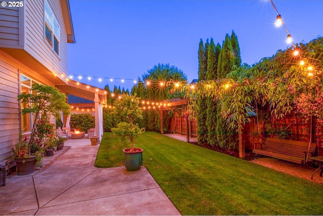 195 Daniel Dr, Eugene, OR 97404 - yard at night with a patio area and a lawn