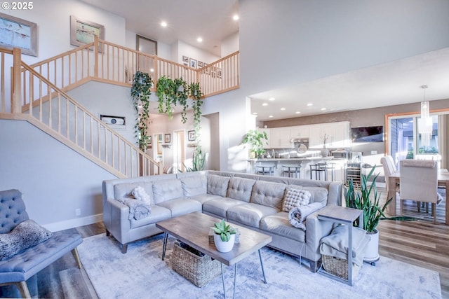 195 Daniel Dr, Eugene, OR 97404 - living area with light wood-style floors, stairs, recessed lighting, and a high ceiling