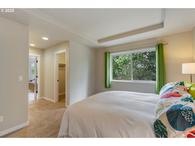 carpeted bedroom featuring recessed lighting, baseboards, and a spacious closet