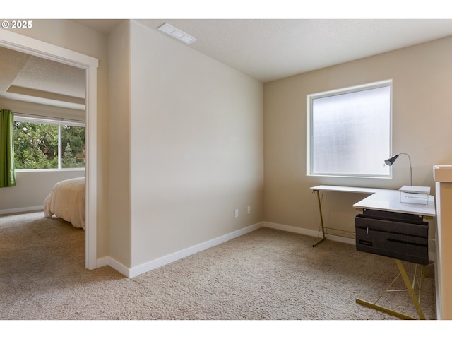 carpeted home office featuring baseboards and visible vents