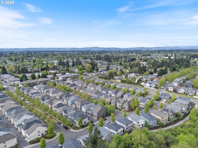 bird's eye view with a residential view and a mountain view