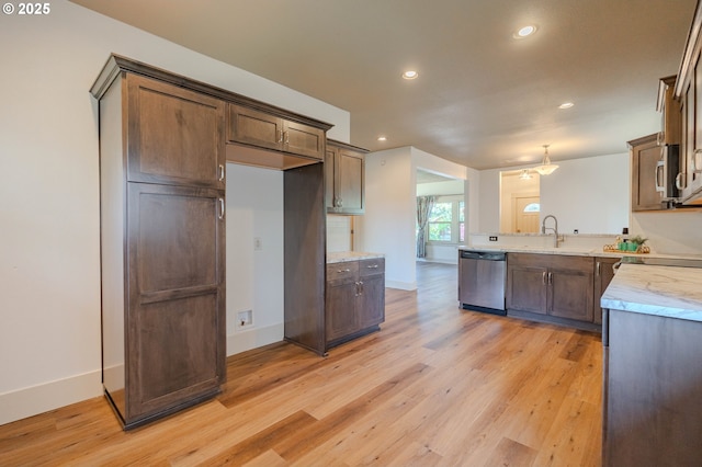 7906 SE Woodstock Blvd, Portland, OR 97206 - kitchen featuring appliances with stainless steel finishes, recessed lighting, light wood-style flooring, baseboards, and a peninsula