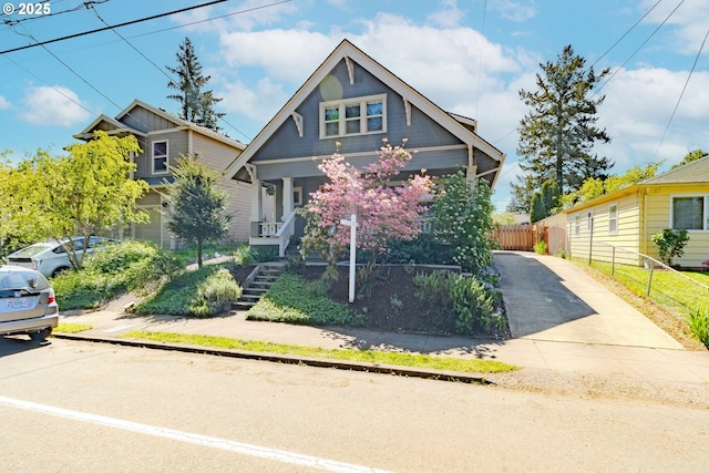 7906 SE Woodstock Blvd, Portland, OR 97206 - view of front of property with driveway, stairs, and a porch