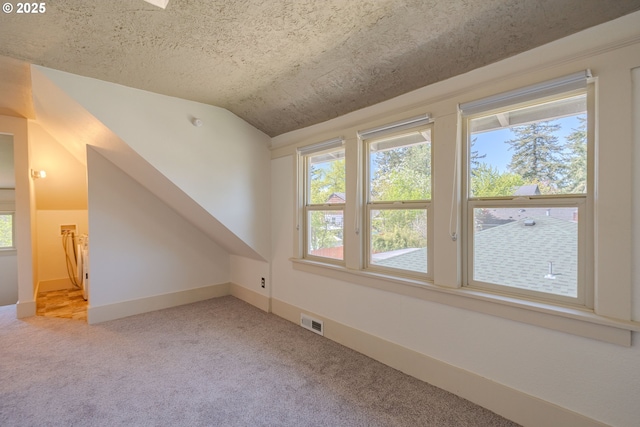 7906 SE Woodstock Blvd, Portland, OR 97206 - bonus room featuring carpet floors, vaulted ceiling, and baseboards