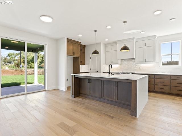 1208 N 44th Pl, Ridgefield, WA 98642 - kitchen with plenty of natural light, a sink, decorative backsplash, and light countertops