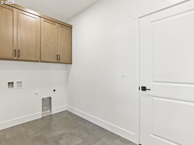 1208 N 44th Pl, Ridgefield, WA 98642 - laundry room featuring hookup for an electric dryer, hookup for a gas dryer, cabinet space, baseboards, and hookup for a washing machine