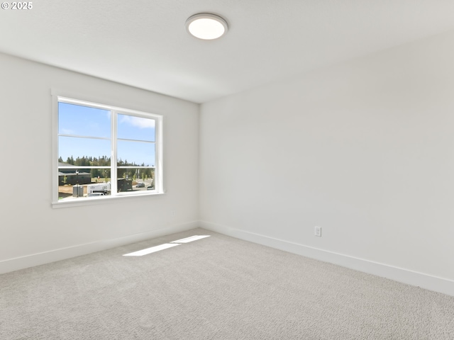 1208 N 44th Pl, Ridgefield, WA 98642 - carpeted spare room featuring baseboards