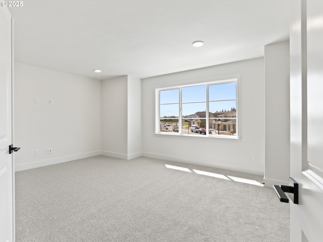 1208 N 44th Pl, Ridgefield, WA 98642 - empty room with carpet floors, recessed lighting, and baseboards