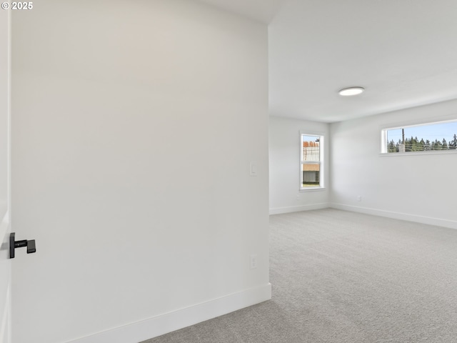 1208 N 44th Pl, Ridgefield, WA 98642 - spare room featuring baseboards and light carpet