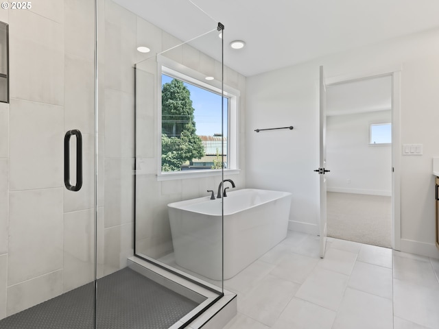 1208 N 44th Pl, Ridgefield, WA 98642 - full bath with baseboards, a freestanding bath, and a shower stall