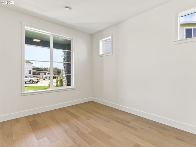 1208 N 44th Pl, Ridgefield, WA 98642 - empty room with baseboards and light wood-style flooring