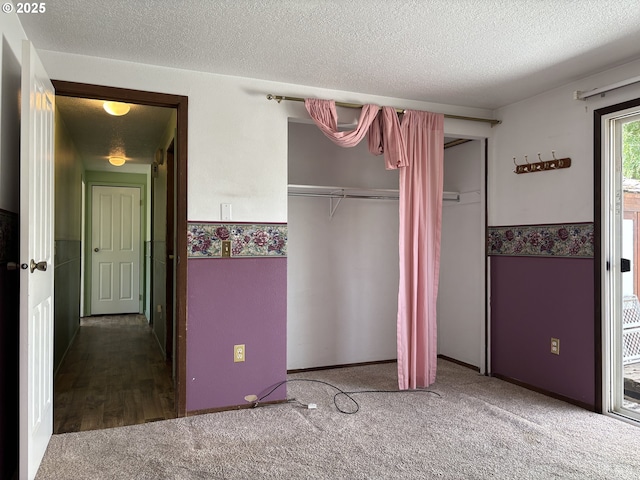 2312 N Pine St, La Grande, OR 97850 - unfurnished bedroom with carpet floors and a textured ceiling