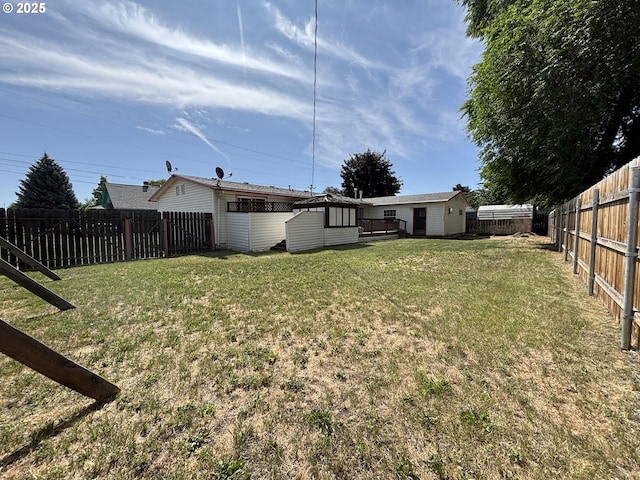 2312 N Pine St, La Grande, OR 97850 - fenced backyard featuring a shed