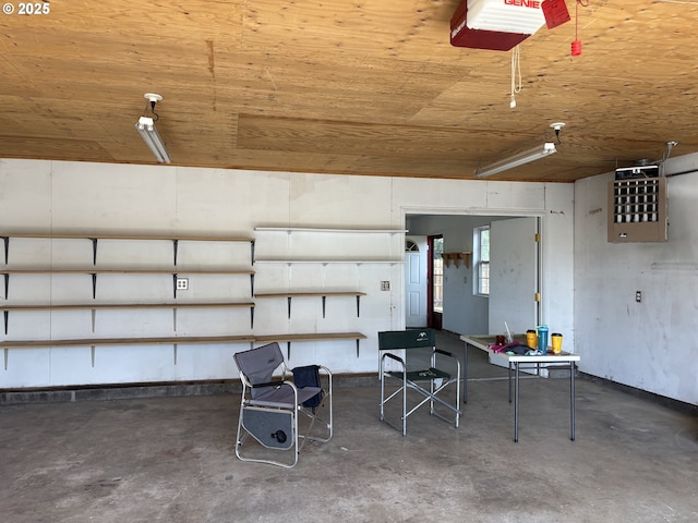 2312 N Pine St, La Grande, OR 97850 - garage with a garage door opener, wooden ceiling, and a heating unit