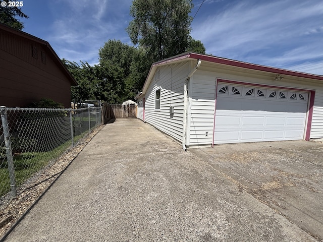2312 N Pine St, La Grande, OR 97850 - view of side of home with a garage and driveway