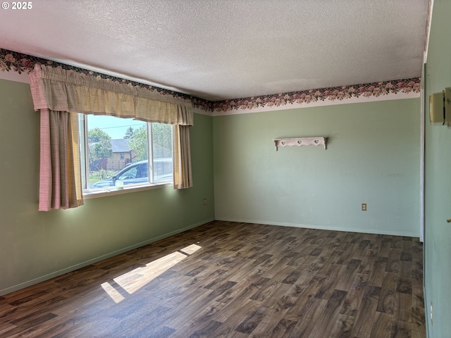 2312 N Pine St, La Grande, OR 97850 - spare room with dark wood-style floors and a textured ceiling