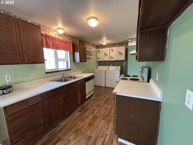 2312 N Pine St, La Grande, OR 97850 - kitchen with white appliances, washer and dryer, dark wood-style flooring, light countertops, and a textured ceiling