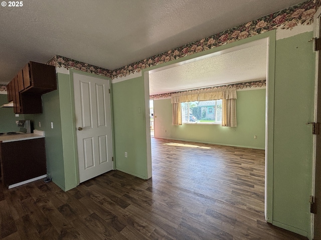 2312 N Pine St, La Grande, OR 97850 - kitchen with a textured ceiling and dark wood-style flooring