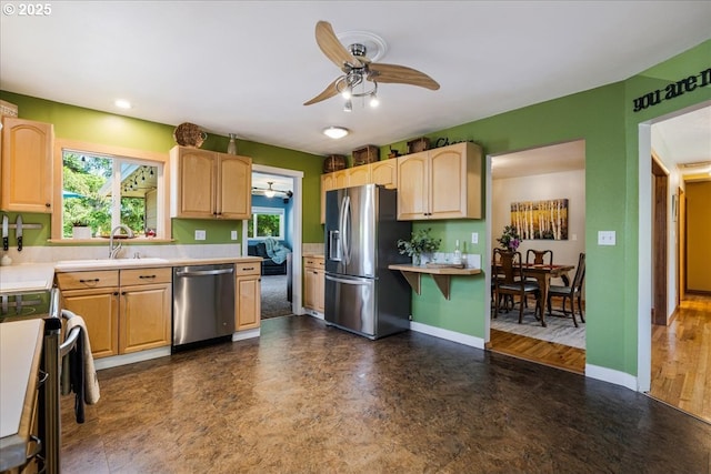 5570 SW Franklin Ave, Beaverton, OR 97005 - kitchen featuring appliances with stainless steel finishes, a ceiling fan, light brown cabinets, light countertops, and recessed lighting