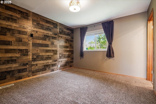 5570 SW Franklin Ave, Beaverton, OR 97005 - empty room featuring wooden walls, carpet flooring, and baseboards